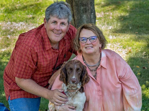 Sinclair family outside next to a tree