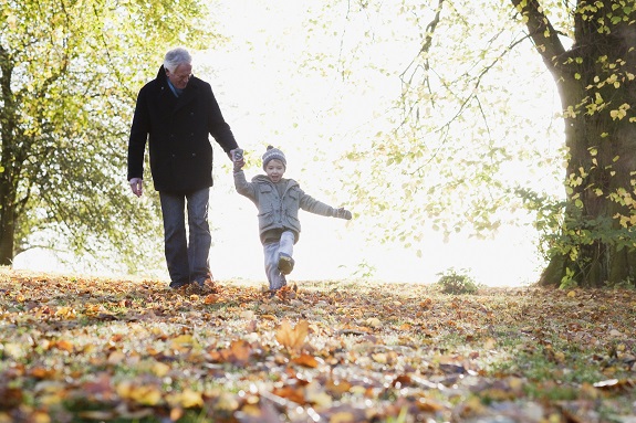 Father and son walking through the woods