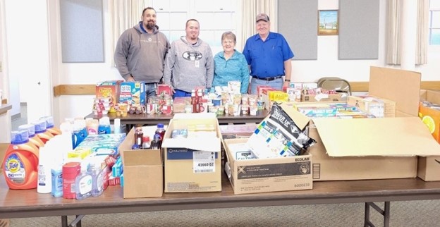 Essentia volunteers with household supplies