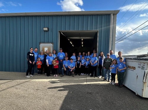 Adults and kids in Essentia light-blue T-shirts