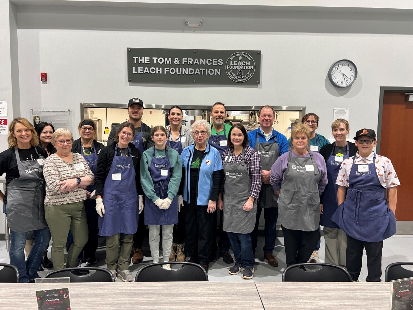 a group of people wearing aprons