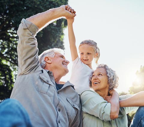 stock photo of grandparents and child outside